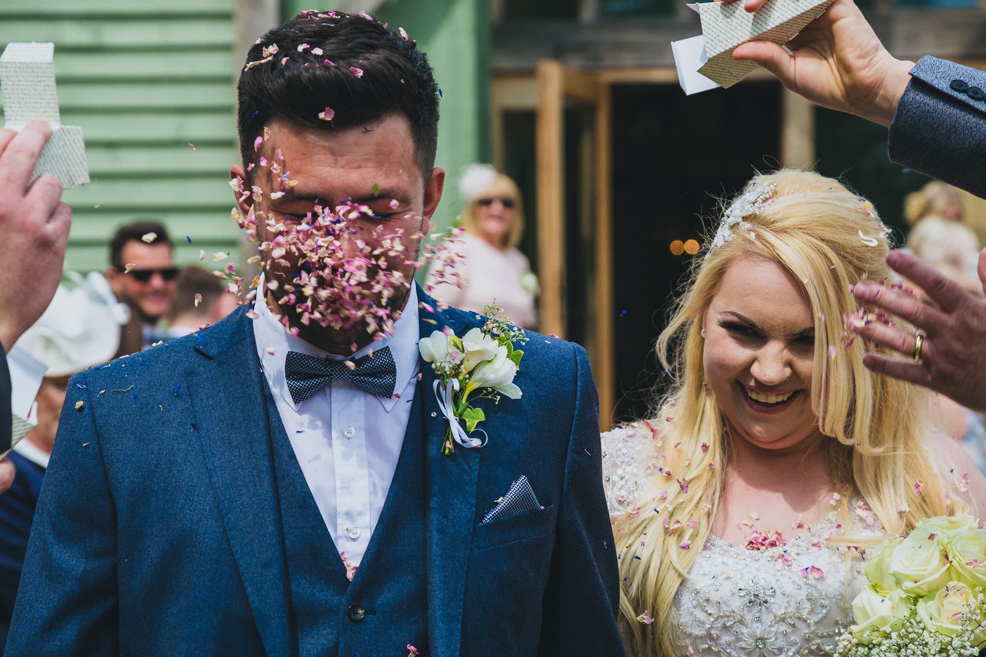 Home Bride and groom confetti in face photograph